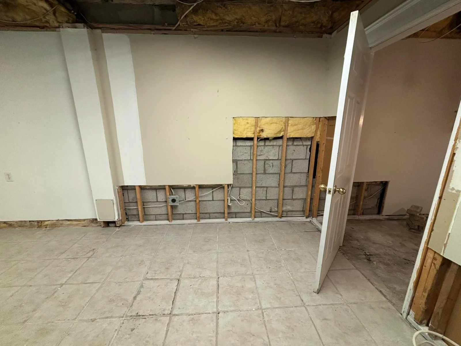 Commercial interior before renovation, set 1: stripped-back walls and exposed ceiling
